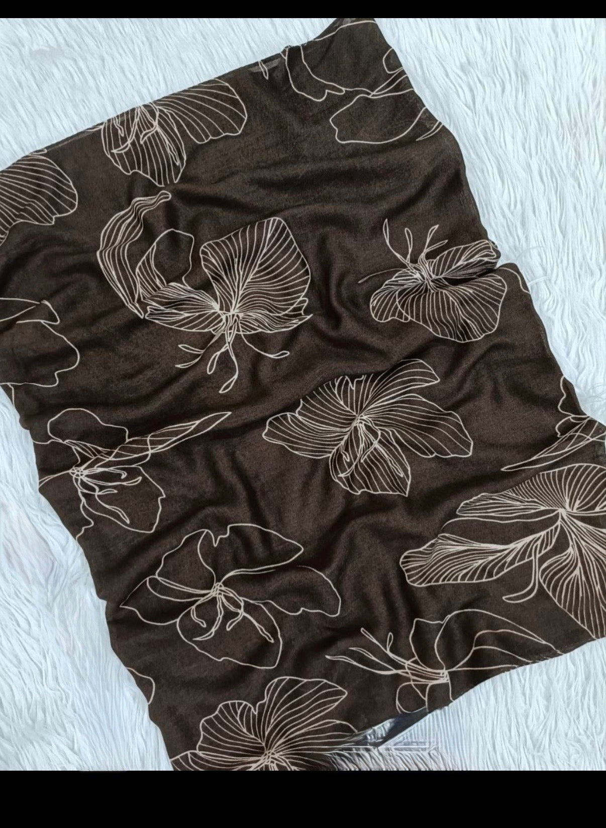 : A tossed botanical print, model hijab