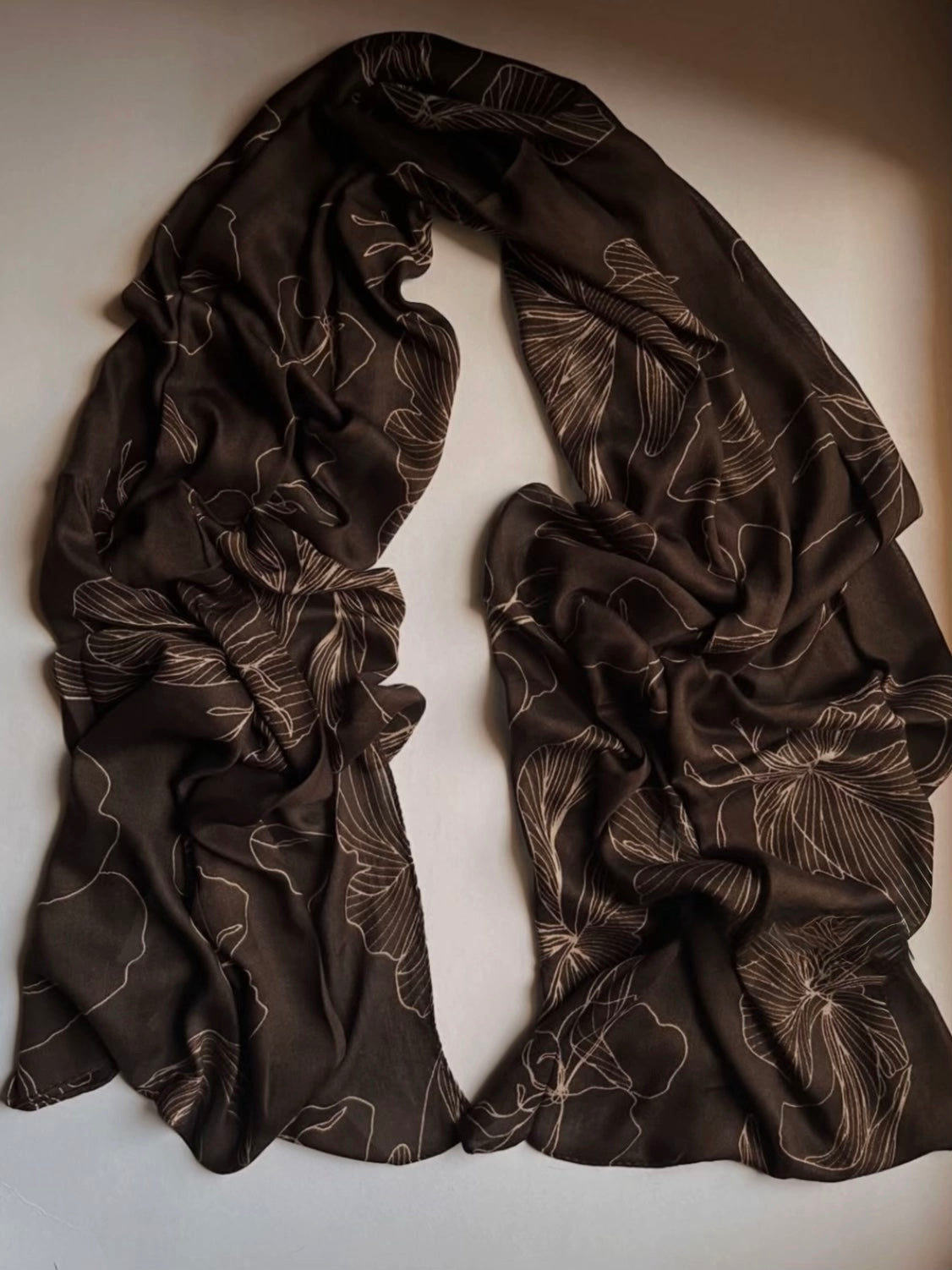 : A tossed botanical print, model hijab